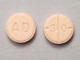 Close-up of Adderall 30mg tablet, a common prescription for ADHD